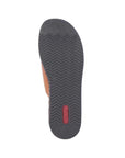 Outsole of slide sandal with textured black rubber and red Rieker logo on heel.