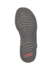 Treaded black rubber outsole of sandal with lines and circle pattern and red Rieker logo on heel.