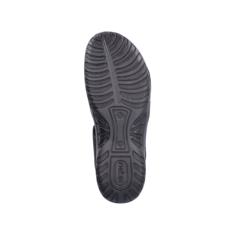 Black outsole of Women's Rieker 64870 Backstrap Sandal with deep grooves for enhanced grip and traction on various surfaces.
