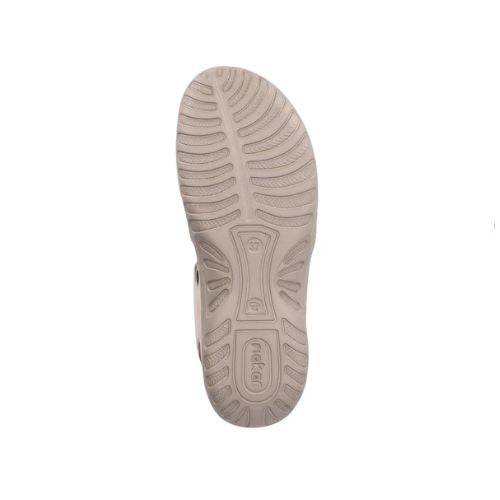 Outsole of Women's Rieker 64870 Backstrap Sandal in beige featuring slip-resistant tread for all-day wear and stability.