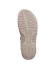 Outsole of Women's Rieker 64870 Backstrap Sandal in beige featuring slip-resistant tread for all-day wear and stability.