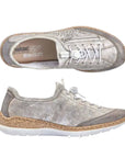 A pair of silver Rieker bungee cord slip-on sneakers with decorative leaf perforations throughout upper, decorative side zipper, faux cork midsole and white outsole.