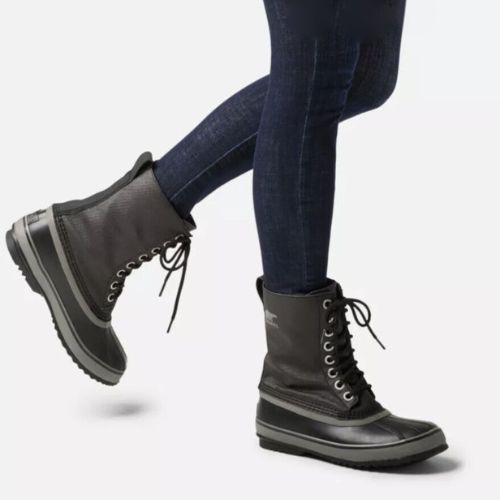 Model wearing Men's Sorel 1964 CVS Waterproof Boot mid-calf style, showcasing durable traction sole and insulated winter design.