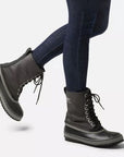 Model wearing Men's Sorel 1964 CVS Waterproof Boot mid-calf style, showcasing durable traction sole and insulated winter design.