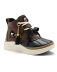 A brown suede platform duck boot with a black rubber toe cap, cream platform midsole, white laces, a black bow on vamp, and a gold tassel polar bear charm.