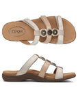 Top and side view of Women's Taos Prize 4 Slide Sandal in beige, showing contoured footbed and supportive leather straps.