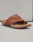 Brown leather Women's Taos Gift Slide Sandal with toe-ring design and contoured footbed, displayed on a neutral background for product showcase.