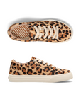 Pair of Leopard print pony hair sneakers with white laces, Taos logo'd footbed and a white thick rubber outsole.