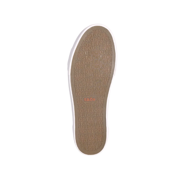 Outsole view of Taos Plim Soul sneaker showing textured rubber sole with Taos branding for enhanced grip and durability.