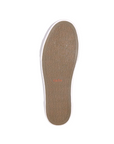Outsole view of Taos Plim Soul sneaker showing textured rubber sole with Taos branding for enhanced grip and durability.