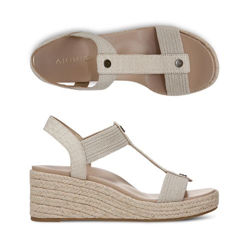 Side and top views of Vionic Calera Wedge Sandal showcasing the cushioned footbed, backstrap, and textured wedge heel for all-day wear.