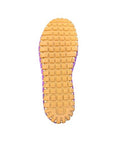 Outsole of purple ballet flat with a square grippy tread pattern