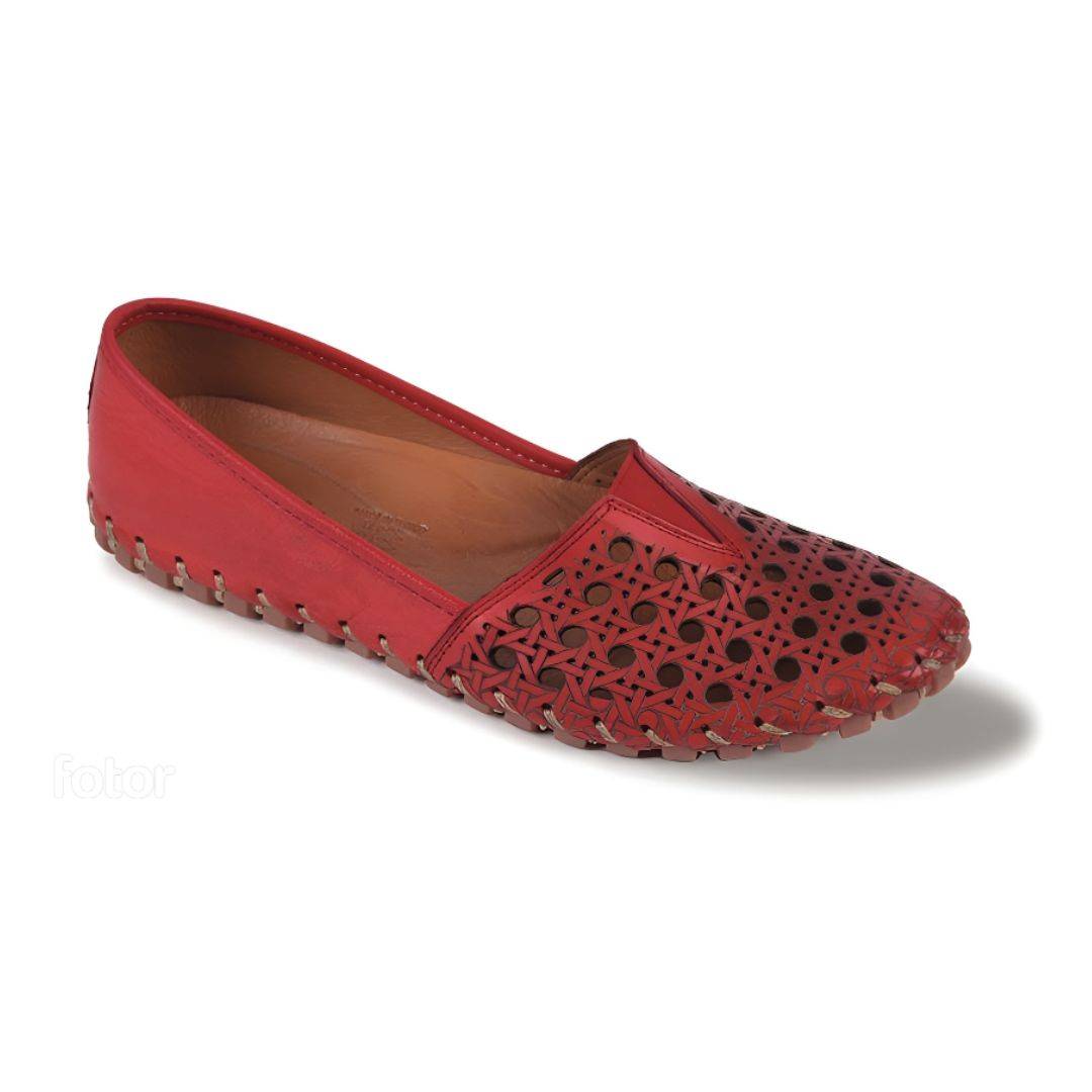 Red flat with circle cutouts on toe, accent stitching to connect outsole and tan footbed.