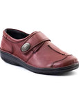 Burgundy slip-on shoe with Velcro cross strap with metal detail and detailing stitching