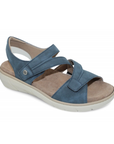 Blue backstrap sandal with two Velcro split design straps, tan footbed and cushioned grey outsole.