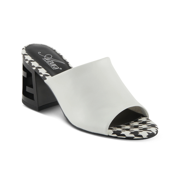 A pair of white open toe leather block heel sandals with a black and white checkered footbed. The black block heel has chunky "Z" shaped cut out.
