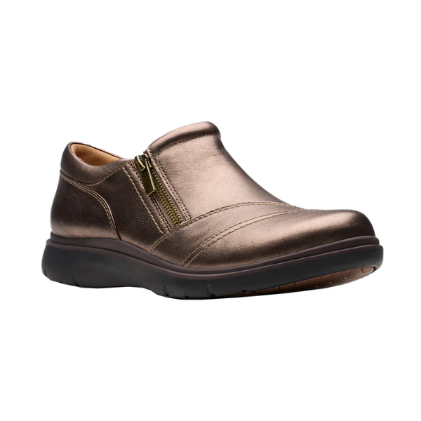 Bronze slip on shoe with detailed overlap upper featuring side zipper and black durable outsole