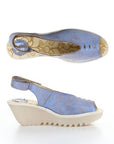 Top and side views of light blue FLY London Yeay Wedge Sandal featuring floral insole and cream-colored ridged sole.
