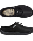 Pair of Black nylon clogs with toe bumper, elastic bungee, beige footbed with brand key words and treaded black outsole.