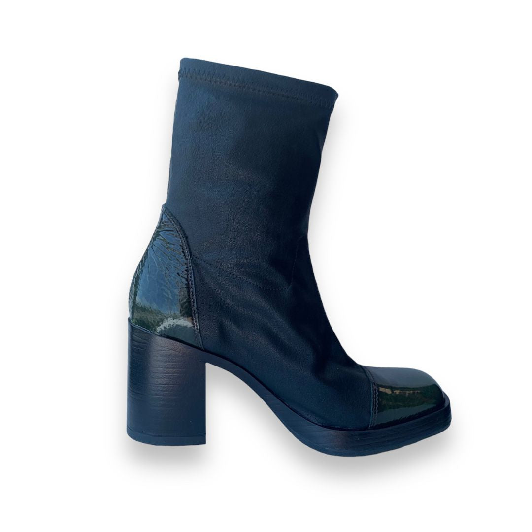 Side profile of Women's Mjus Florentina leather heeled boot showcasing square toe and sleek ankle-high design.