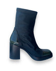 Side profile of Women's Mjus Florentina leather heeled boot showcasing square toe and sleek ankle-high design.