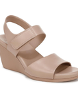 Beige wedge sandal with Velcro strap and Naturalizer logo on footbed.