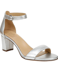 Silver block heel sandal with buckled ankle strap and tan Naturalizer logo'd footbed.