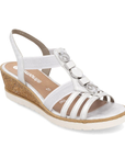Silver slingback wedge sandal with gladiator style straps, shimmery pearled charm t-strap, tan Remonte logo'd footbed, cork wedge and white outsole.