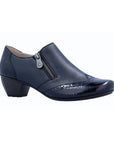 Navy leather dress shoe with side zipper, patent toe accent with brogue imitation and low block heel.