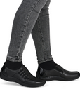 Black shoes worn with grey jeans.