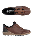 Pair of Brown leather slip on shoes with black accents, black Rieker logo'd footbed, faux elastic lace details and a treaded black outsole.