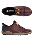 Pair of Red leather slip on shoe with navy accents, faux yellow, brown and blue elastic lace details, black Rieker logo'd footbed and a treaded black outsole.