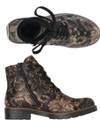 A pair of lace-up ankle boots with a dark brown and black floral camouflage pattern, black laces, and a chunky black outsole.
