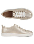 Pair of Pair of soft shimmery gold casual sneakers with tan Vionic logo'd footbed and beige rubber outsole.