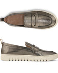 A pair of Women's Leather Loafers in Silver metallic leather, tan Vionic logo'd footbed with white sole.