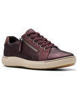 Nalle sneaker in wine. Burgundy reptile print leather uppers with nubuck accents. Six eyelet lace closure and side zipper with silver hardware. White midsole.