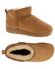 Pair of A tan suede ankle boots with a cork midsole, cream fur lining, moccasin style accent stitching and tan outsole.