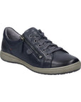 A dark navy leather sneaker with navy laces, a side zipper, and pewter hardware. Midsole is grey, outsole is black.