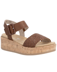 Brown wedge sandal with black woven toe strap, buckled back strap, tan Remonte logo's footbed, faux cork midsole and tan outsole.