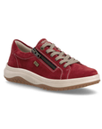 A red suede sneaker with a side zipper, beige laces, white accent stitching, cream midsole, and a brown tan outsole.