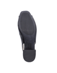 Black light treaded outsole of heeled slingback with Rieker logo stamped in middle.