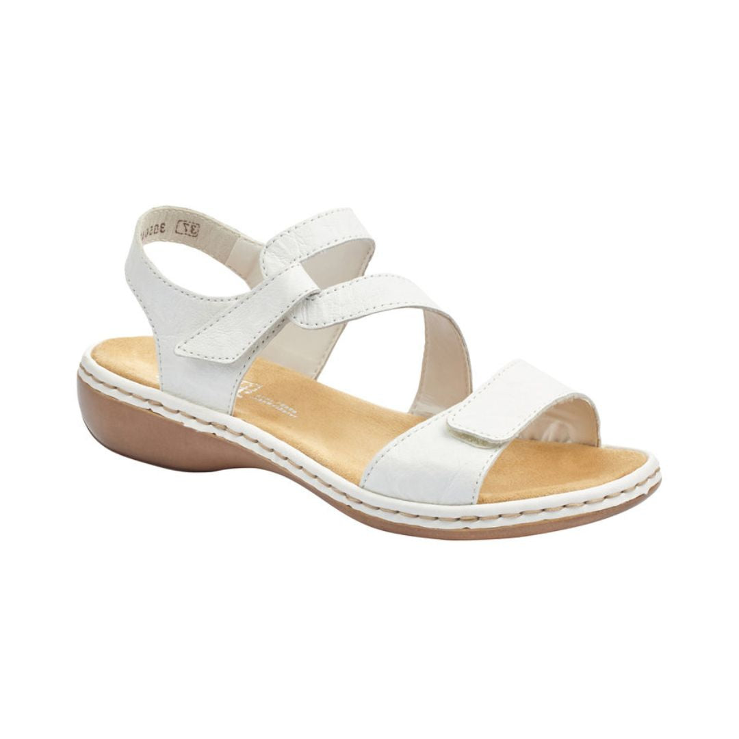 White leather Rieker 659C7 women's sandal with Velcro straps and cushioned footbed for breathable, stylish support.