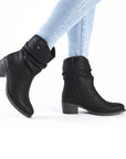 Model wearing Women's Rieker 73170 Western Boots with skinny jeans, highlighting lightweight comfort and stylish ankle boot design.