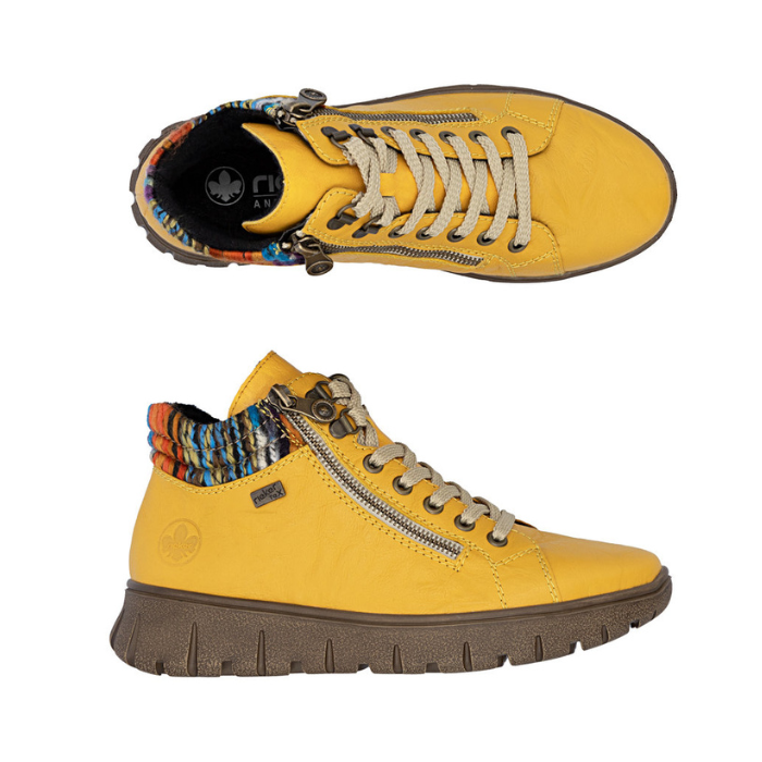 Pair of Yellow ankle boots with dual zipper, beige laces, multi-color knit cuffs and brown light treaded outsoles.