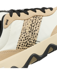 Close-up of a side of sneaker with cheetah print, beige, black, and white upper.