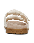 Vionic logoo'd heel of sandal with white strap and brown outsole.