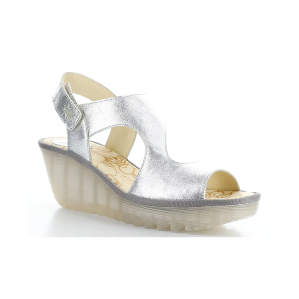 Yoxa Wedge Sandal in metallic silver with Velcro strap, 2.5-inch wedge heel, and cushioned floral-patterned insole.
