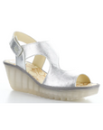 Yoxa Wedge Sandal in metallic silver with Velcro strap, 2.5-inch wedge heel, and cushioned floral-patterned insole.