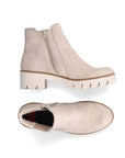 Pair of A beige Chelsea ankle boots with a chunky sole and side elastic goring.