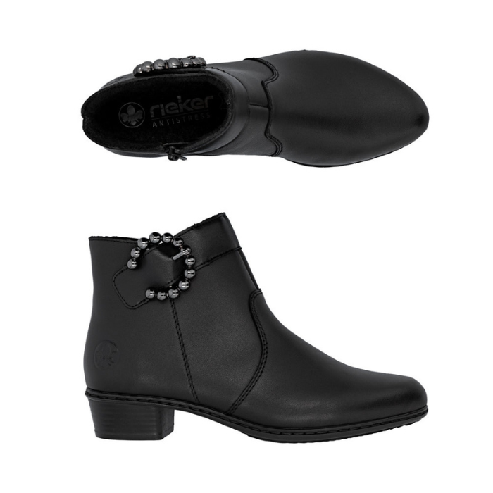Pair of black ankle boots with decorative bead buckle, inside zipper and low heel.
